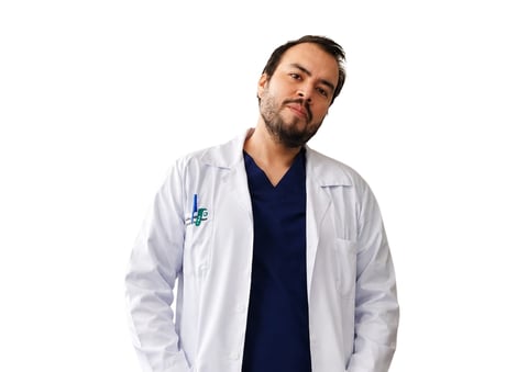 Male healthcare professional wearing white lab coat with blue logo over dark navy shirt against white background